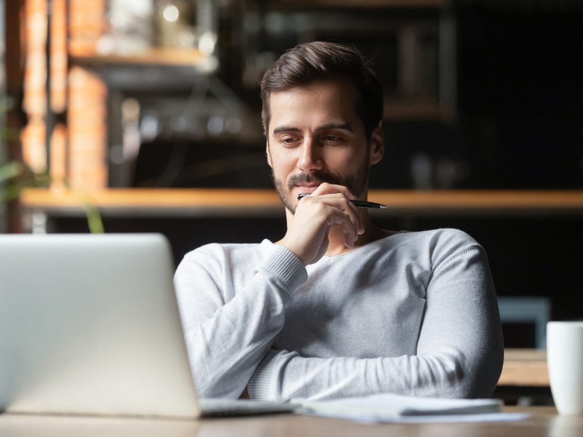 Energy worker working on laptop at home